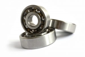 three silver ball bearings stacked up